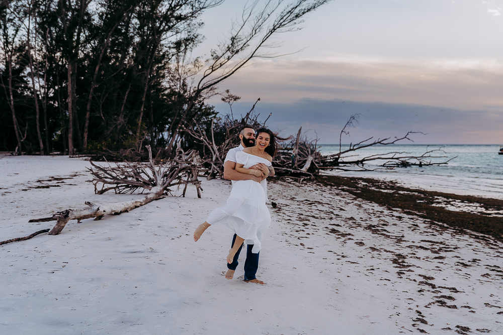 playful couple on the beach in sarasota