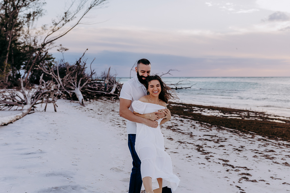 couple hugging playfully in sarasota