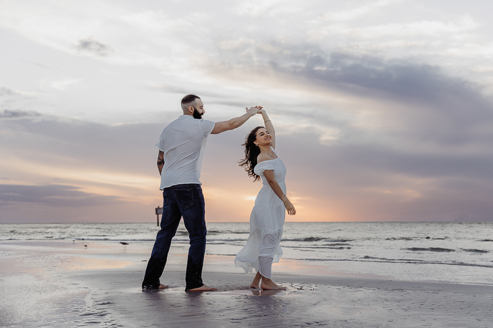 couple dancing on the beach at sunset in sarasota