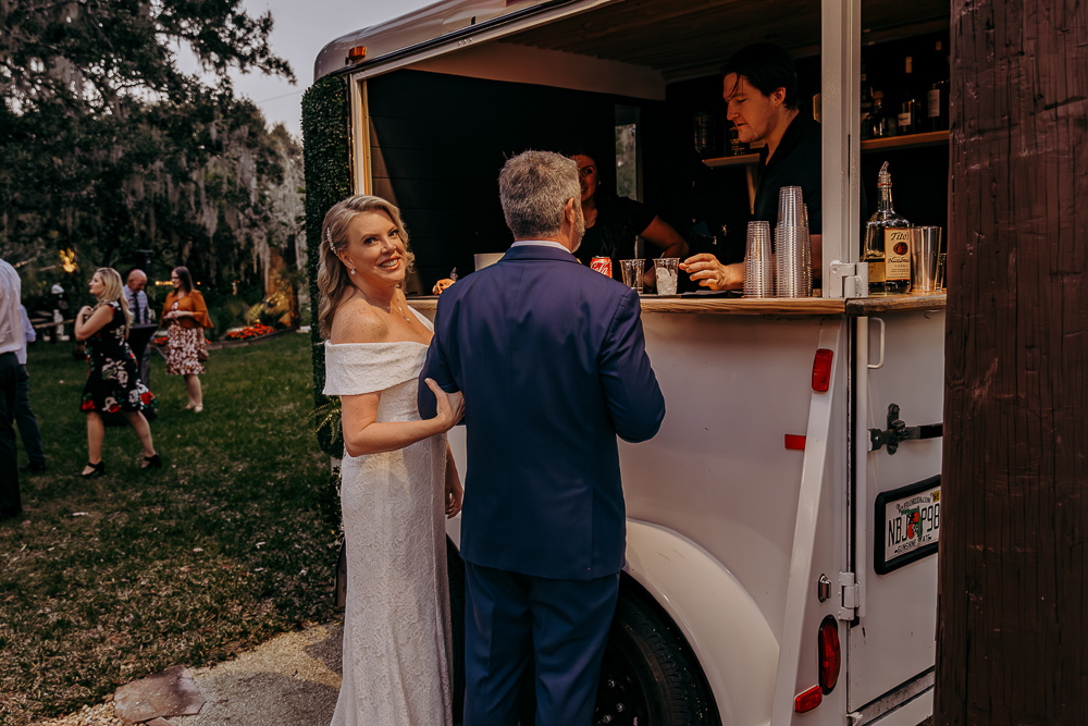 bride and groom enjoying a cocktail from hub tap a mobile bartending service in tampa florida 