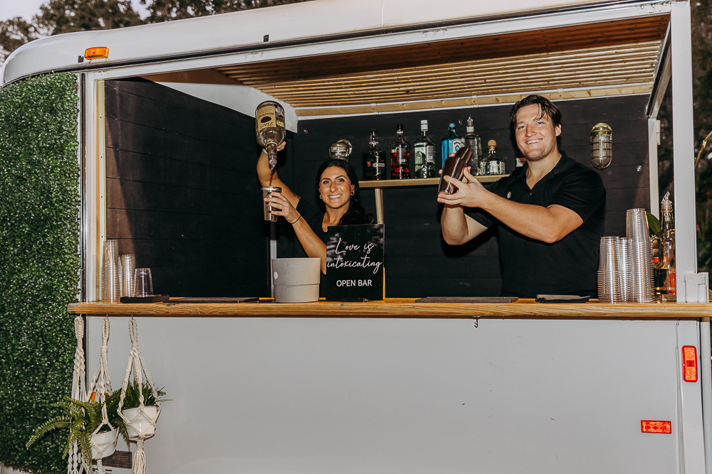 bride and groom enjoying a cocktail from hub tap a mobile bartending service in tampa florida 