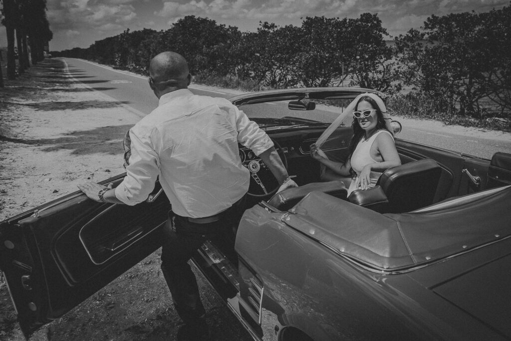 couple with a vintage mustang