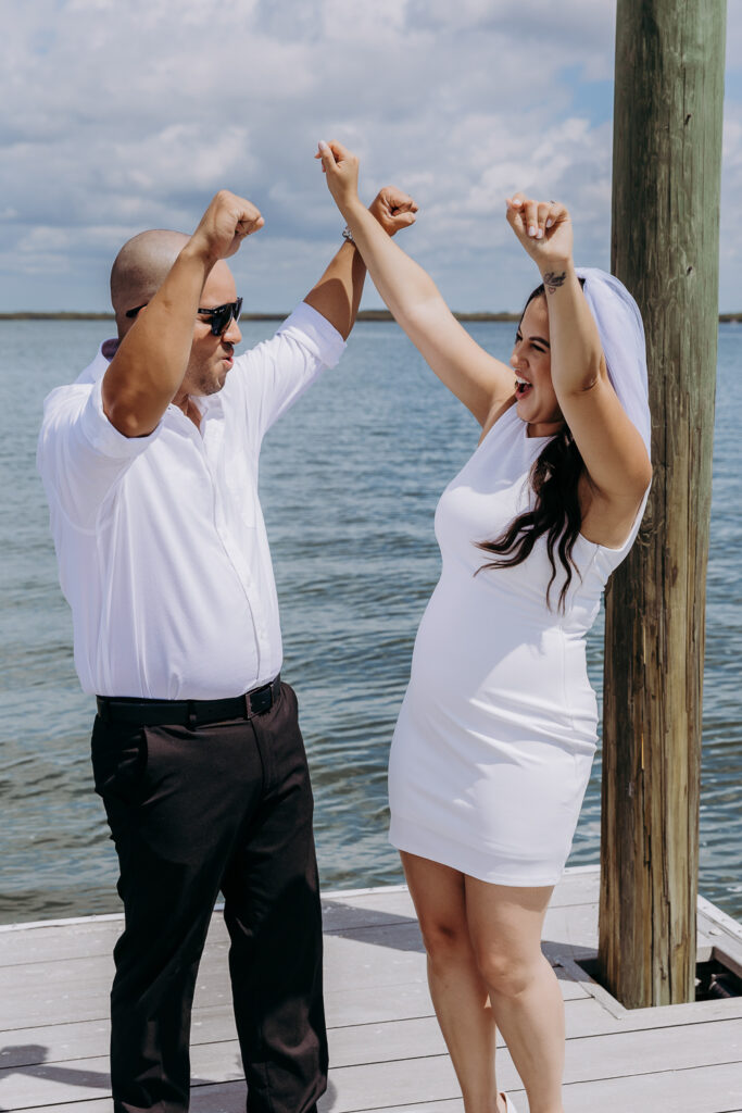 tampa elopement photographer taking a photo of couple in vintage mustang