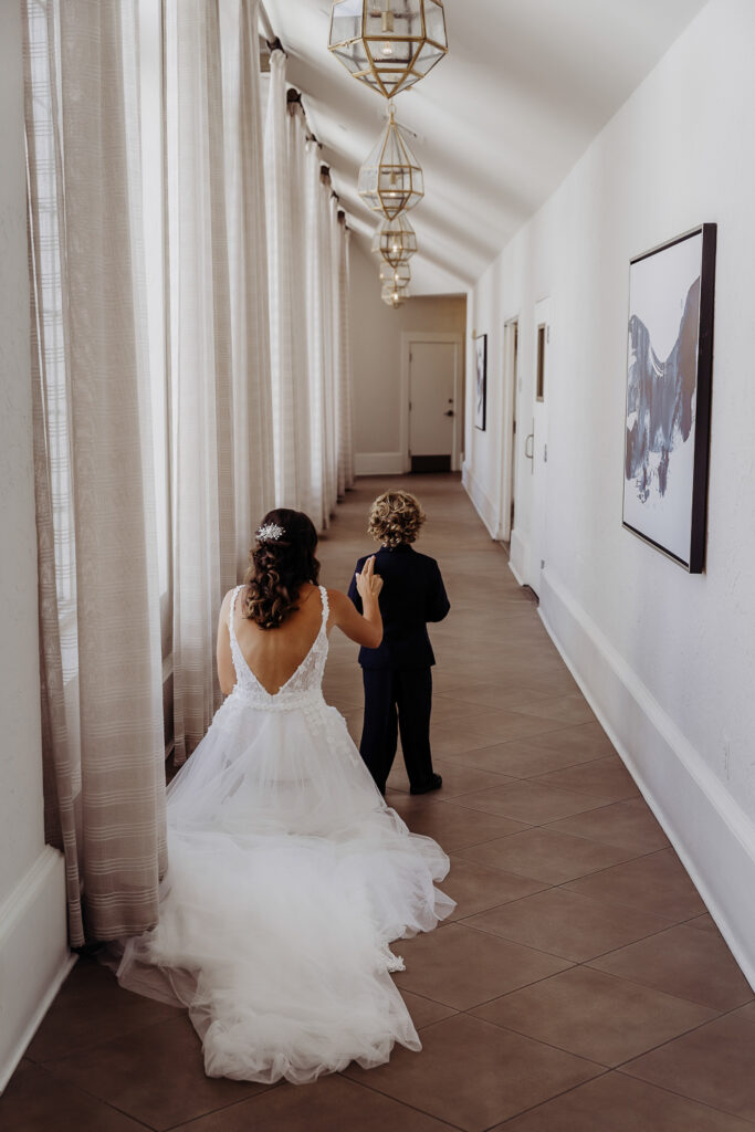 brides first look with her son on her wedding day with a tampa wedding photographer