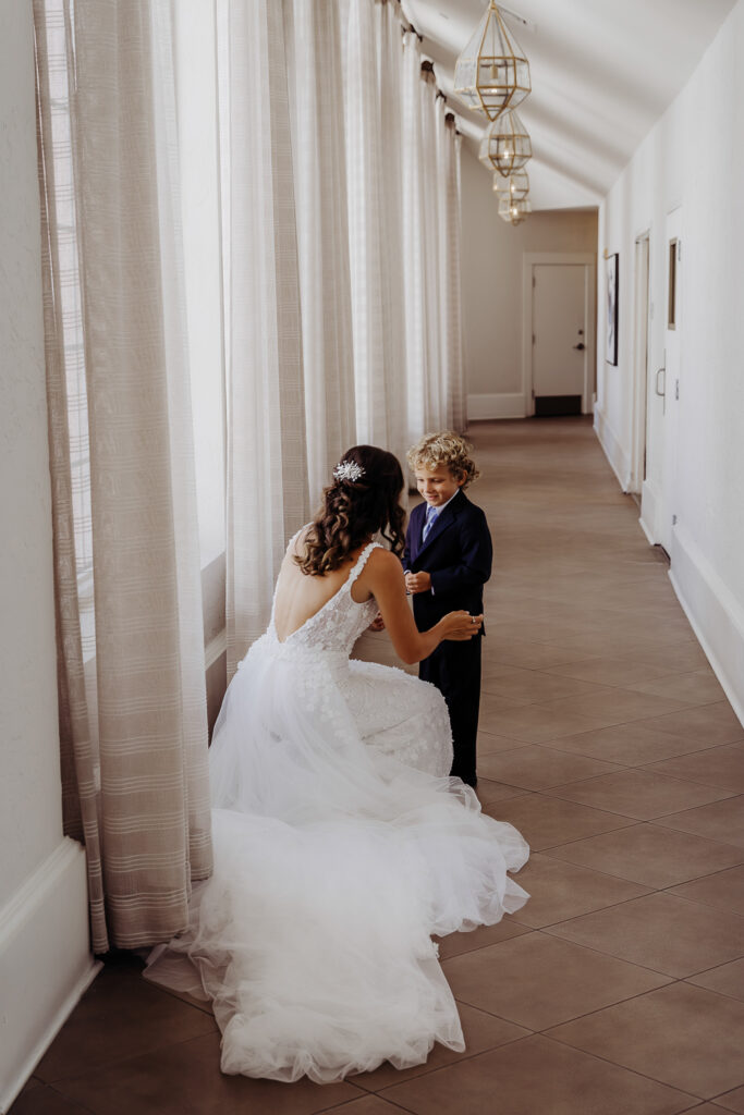 brides first look with her son on her wedding day with a tampa wedding photographer