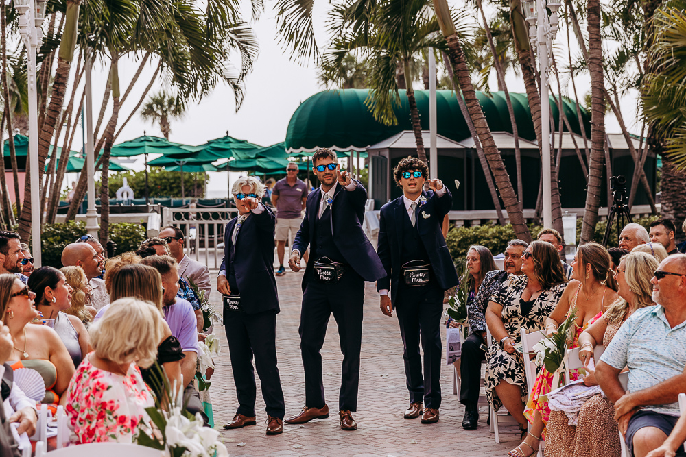 flower boys walking down aisle at a wedding at the don cesar