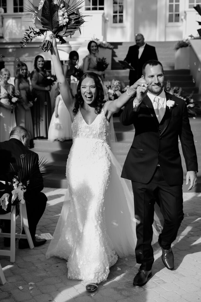 bride and groom walking down the aisle after saying i do at the don cesar in st pete florida