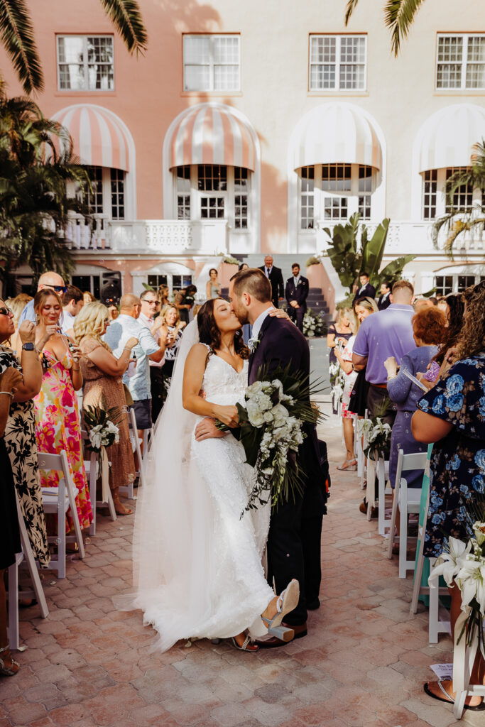 bride and groom walking down the aisle at their don cesar wedding in st pete florida