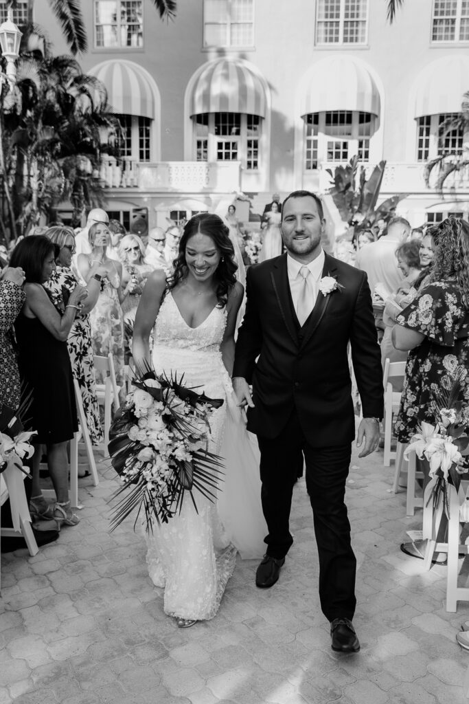 bride and groom walking down the aisle after saying i do at the don cesar in st pete florida