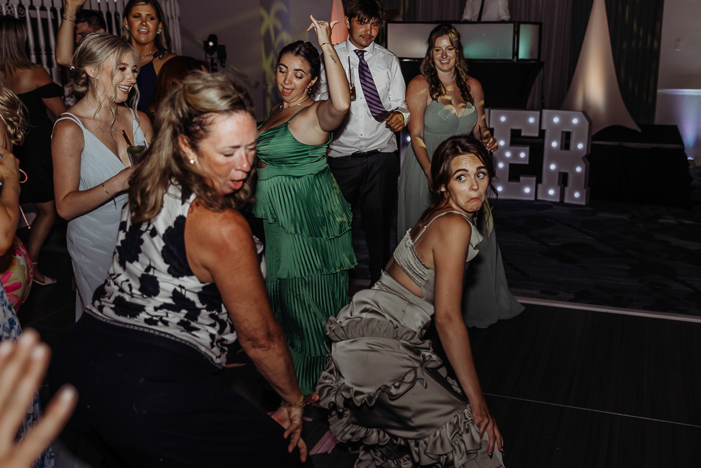 two ladies dancing at the wedding reception