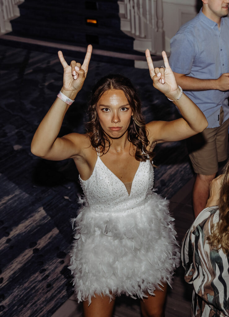 bride rocking out on the dance floor at her wedding