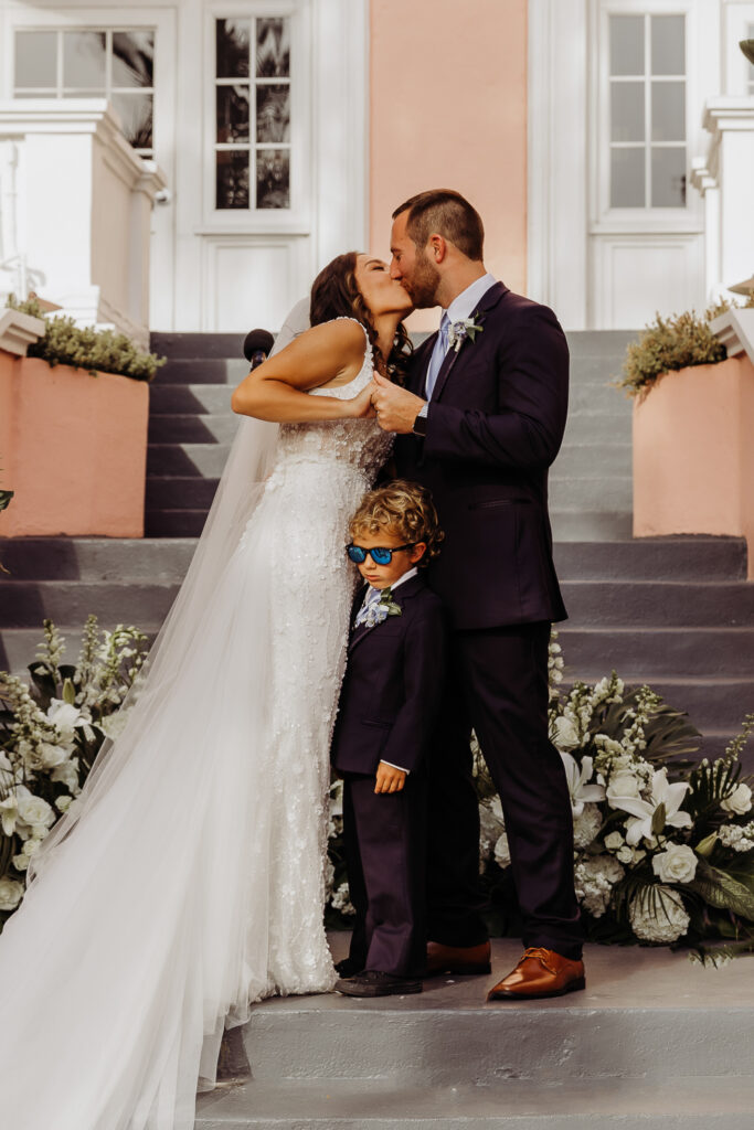 first kiss as mr and mrs at don cesar hotel wedding