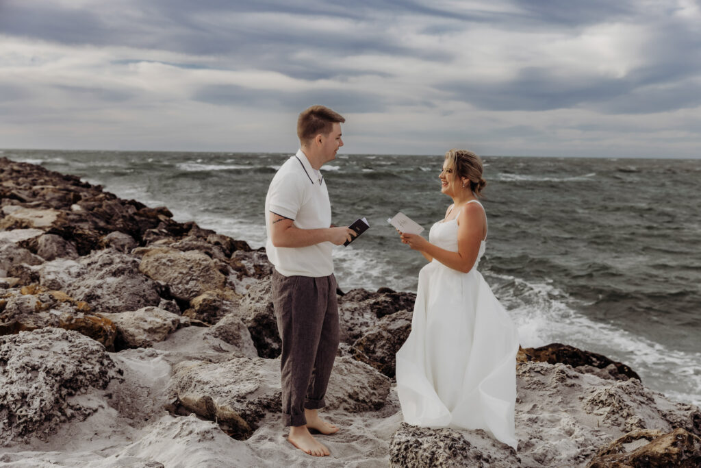 couple reading vows from vow books that were listed on their elopement checklist 