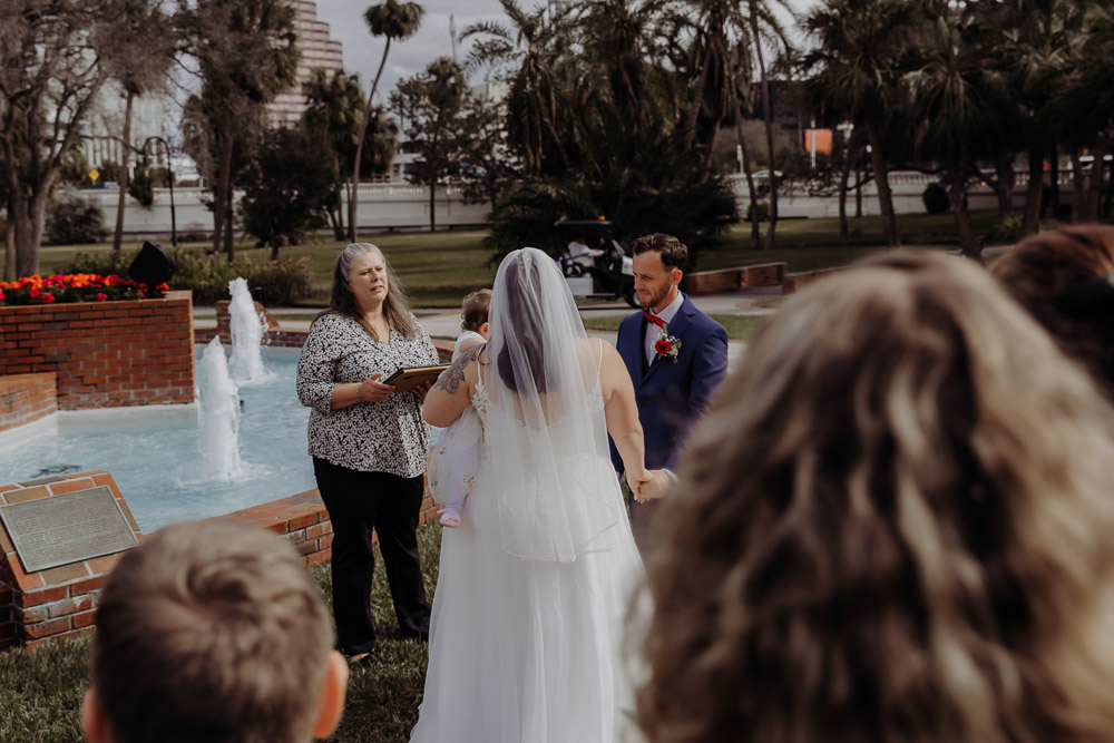 photos of couple during their plant park tampa ceremony for their florida elopement