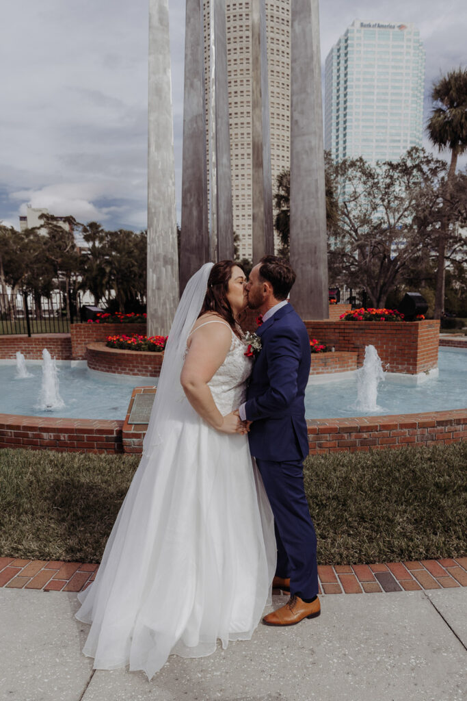 first kiss as a married couple for their plant park tampa elopement 
