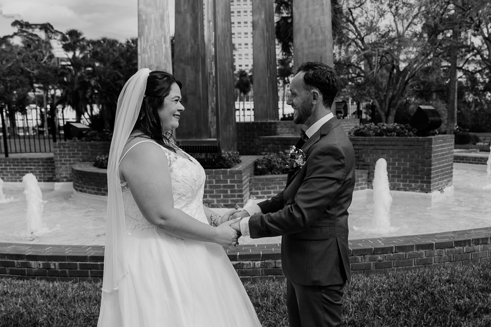 couple smiling at one another after their florida elopement ceremony in plant park tampa 