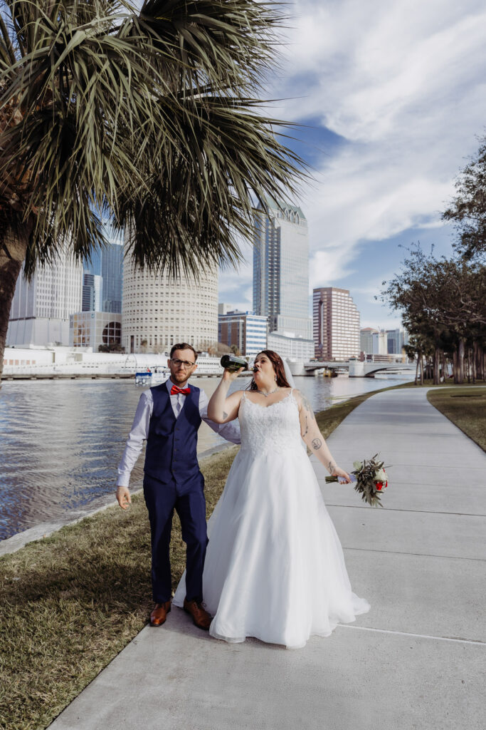 couple drinking champagne after their elopement 