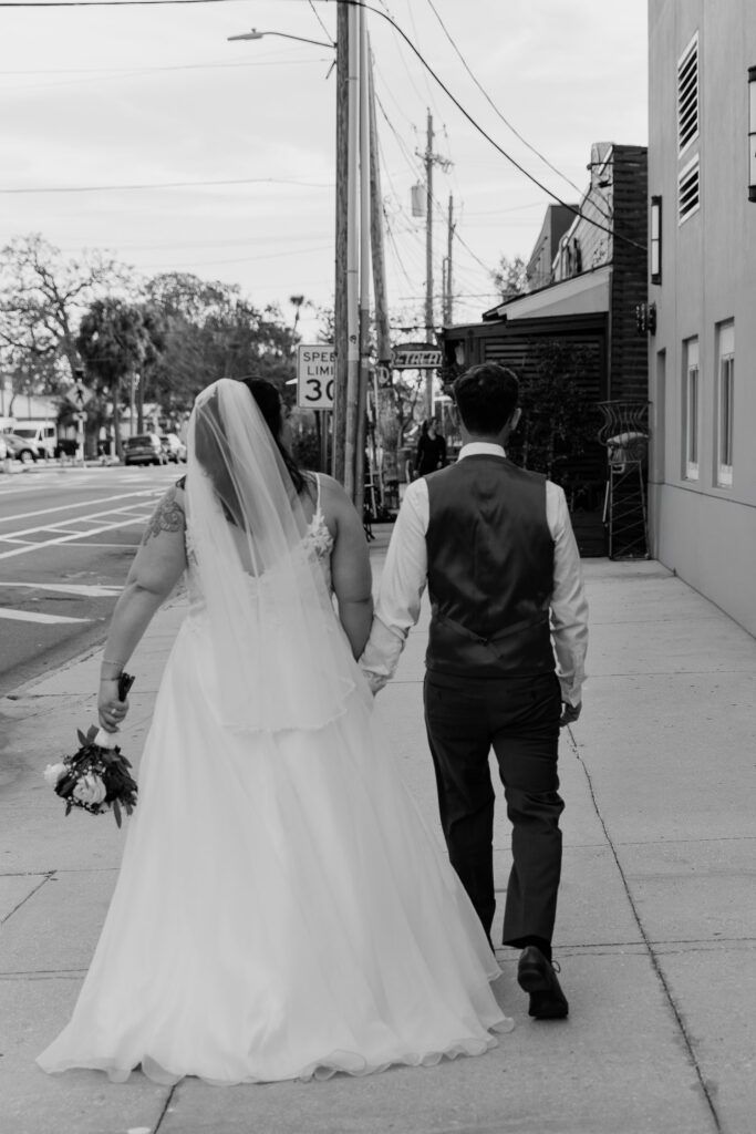 couple walking to the bar they had for their date as for their florida elopement