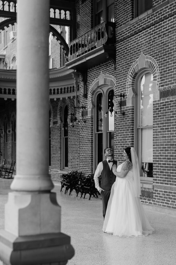 couple laughing together after their florida elopement in plant park tampa 
