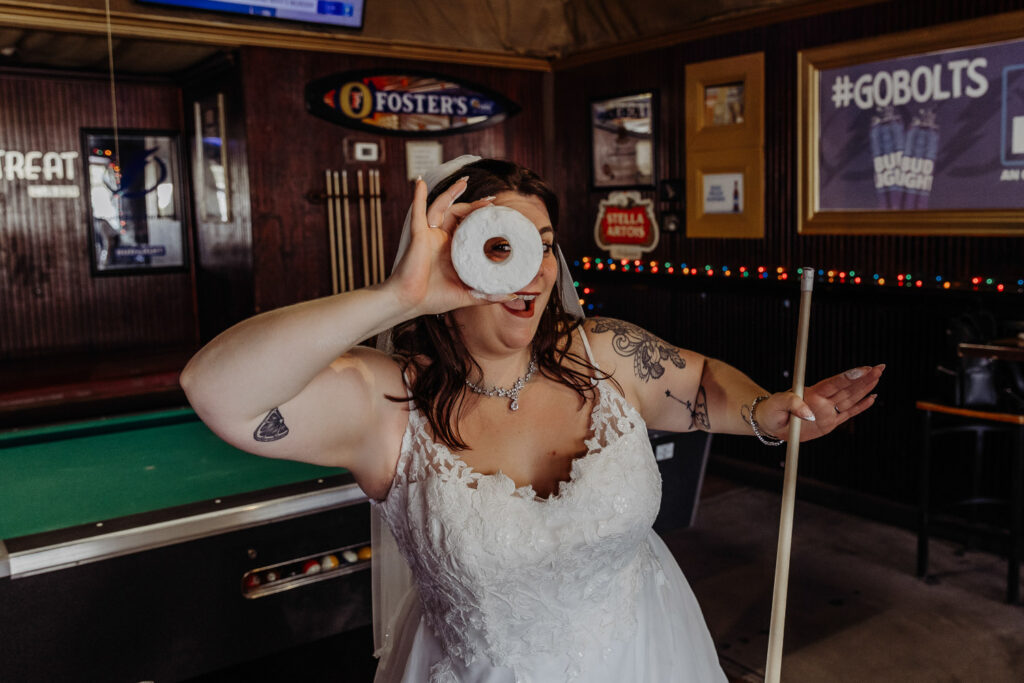 couple playing pool after their elopement in tampa 