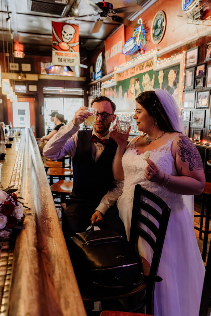 couple taking a shot to celebrate their florida elopement 