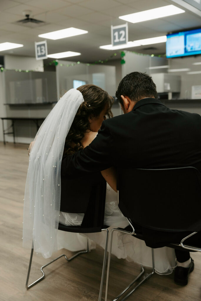 couple looking over paperwork at the courthouse 