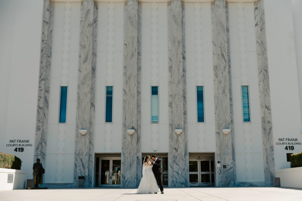 couple sharing a moment outside after their courthouse elopement 