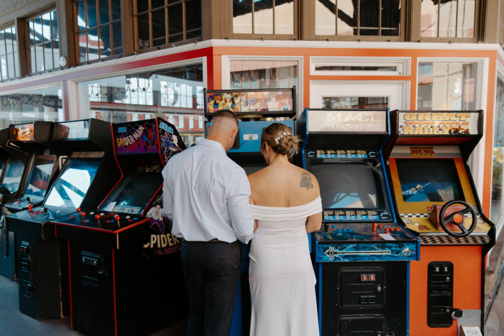 couple celebrating their elopement at an arcade in tampa 