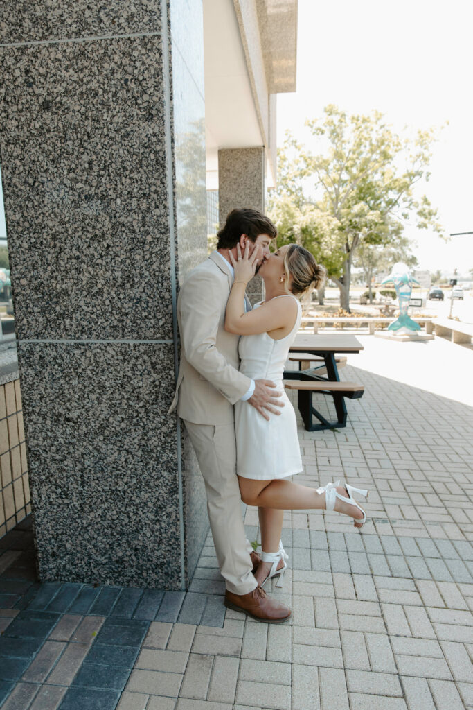 happy couple kissing for their courthouse elopement 