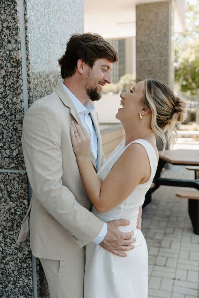 couple laughing together after their courthouse elopement 