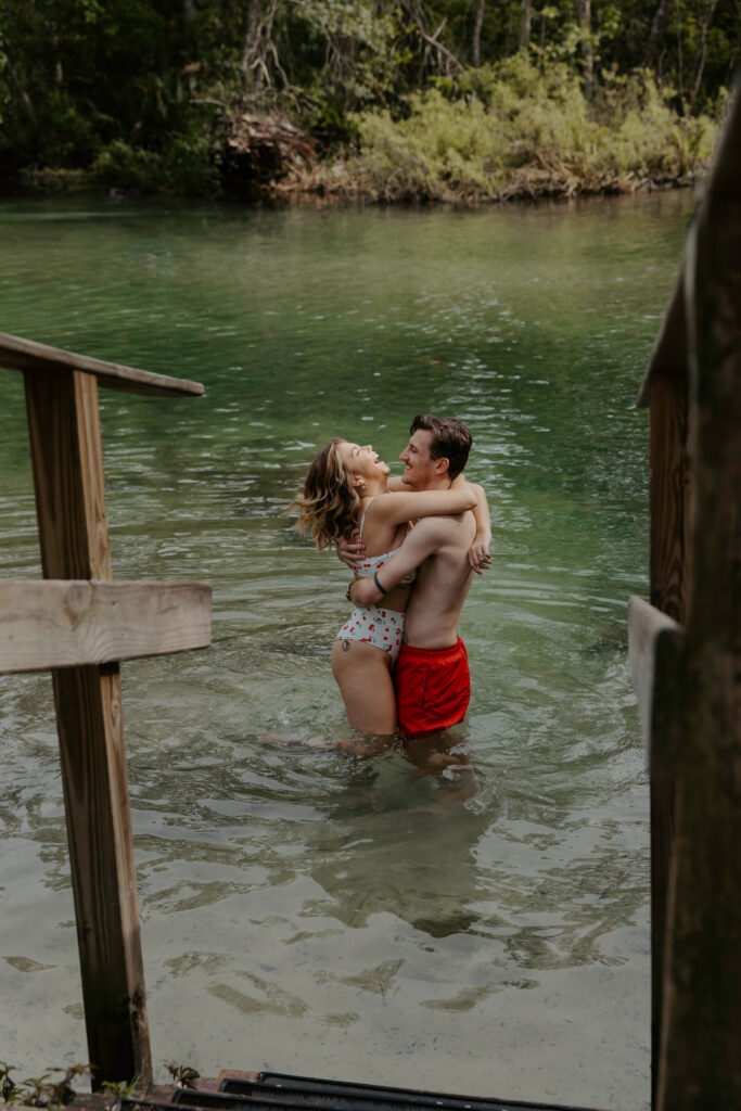 couple having fun at weeki watchee springs for their elopement vs intimate wedding in tampa