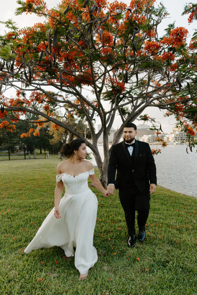 picture of couple running after their intimate wedding at davis island garden club in tampa