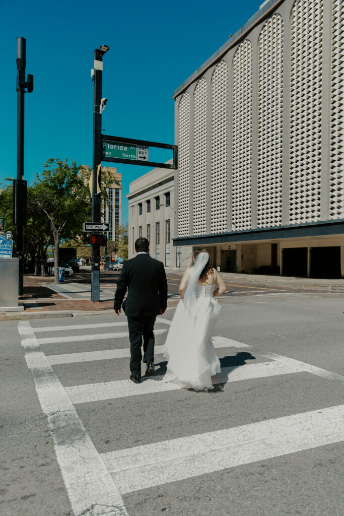 couple walking downtown to elope in tampa
