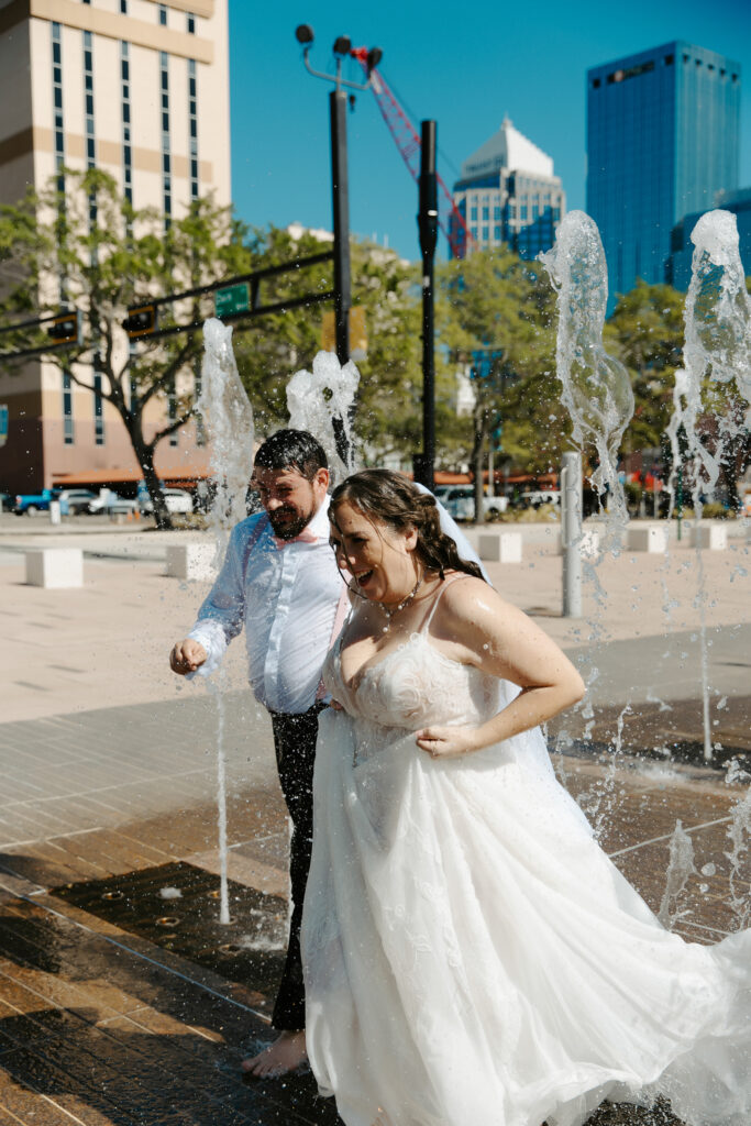 couple celebrating their elopement in tampa on the riverwalk