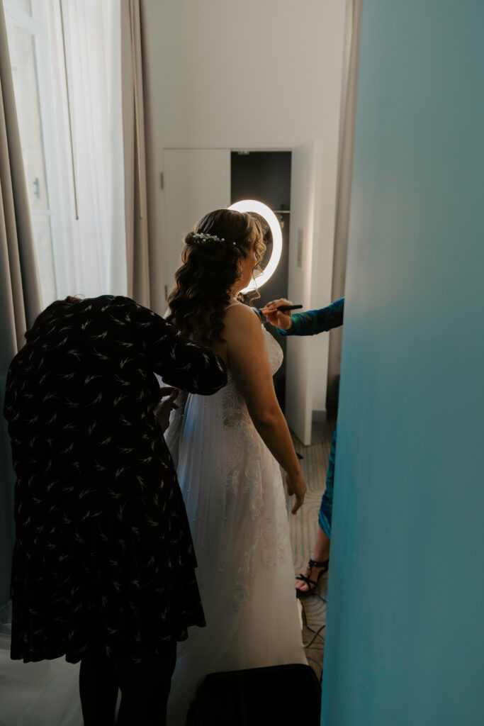 bride getting ready at the hotel before her elopement in tampa
