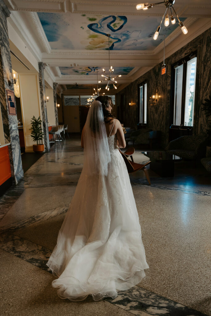 bride getting ready at the hotel before her elopement in tampa