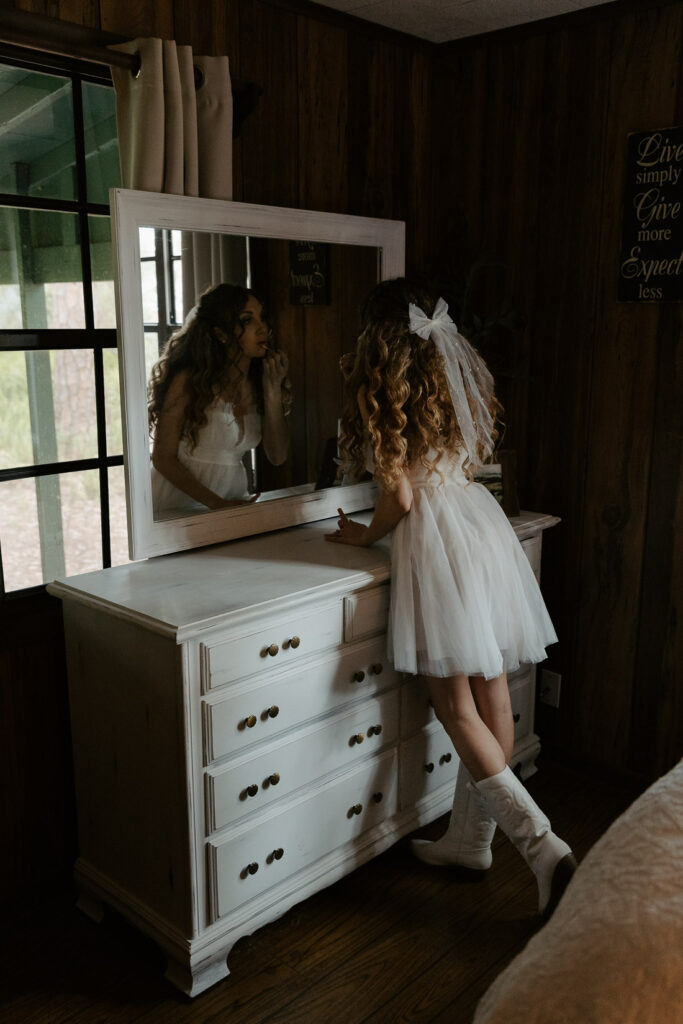 bride getting ready in a cabin for her tampa elopement vs intimate wedding