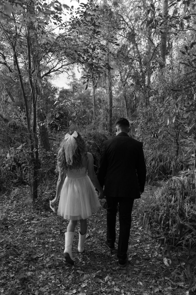 couple walking to their elopement vs intimate wedding
