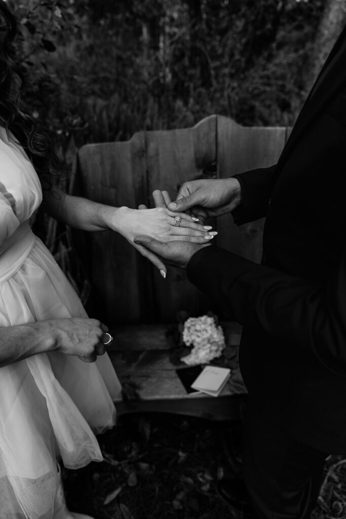 couple exchanging rings during their elopement vs intimate wedding in tampa