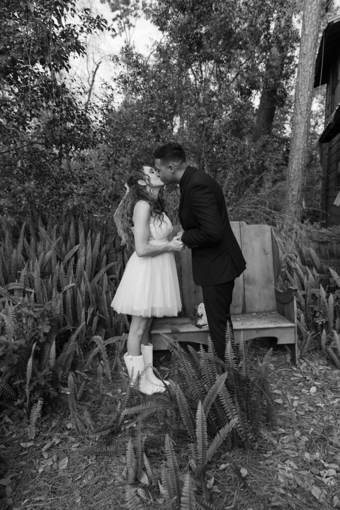 couple kisses after saying I do