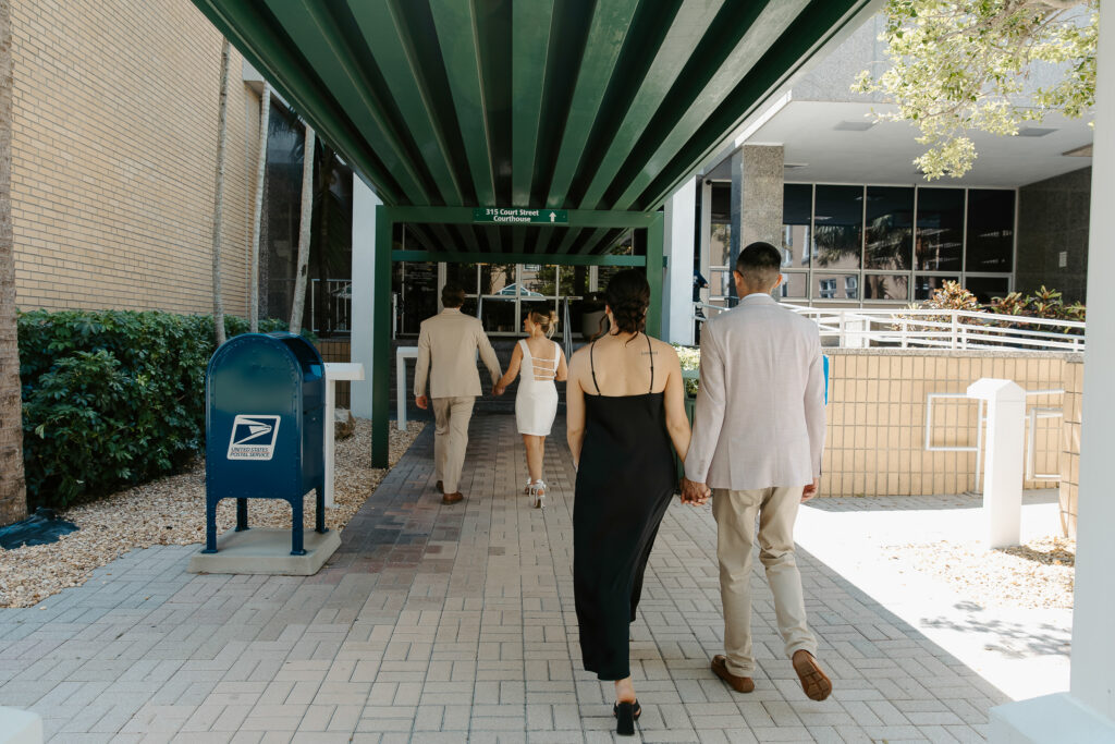 couple walking into the courthouse in clearwater to get married