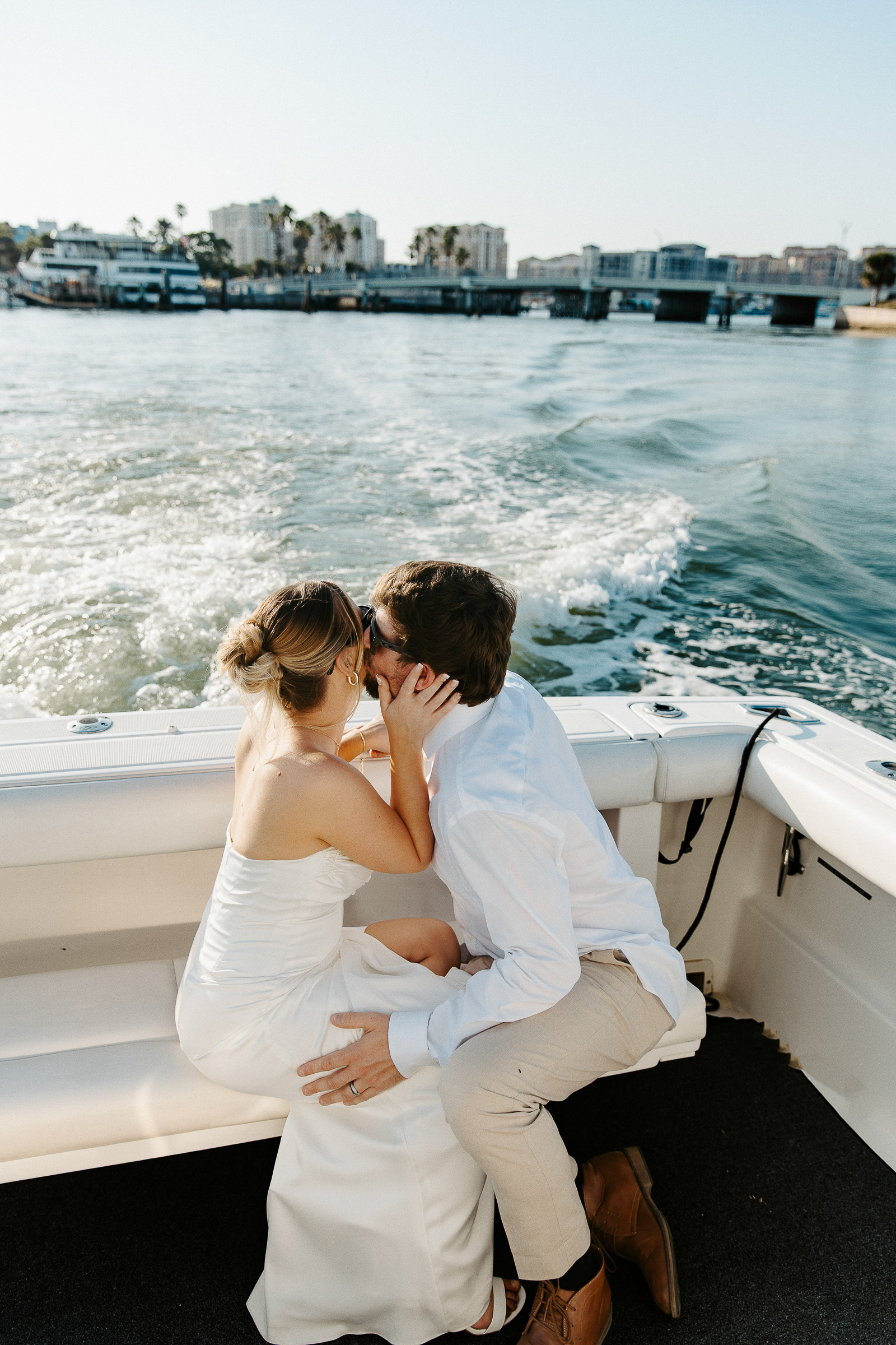 the groom kissing his bride after eloping in clearwater