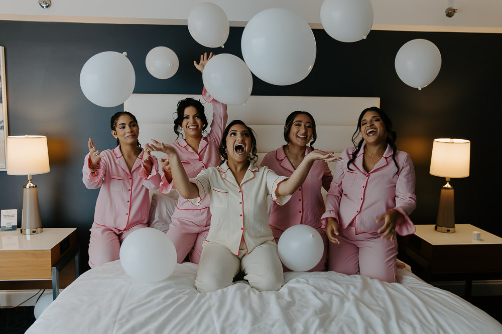photo of the bride and her bridesmaids before her wedding at the davis island garden club in tampa