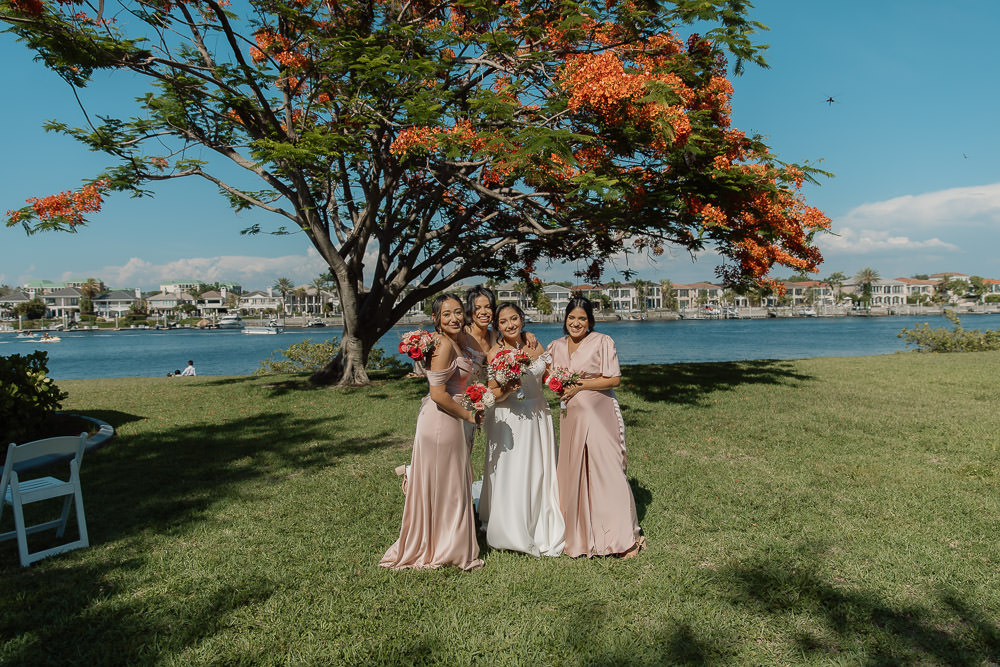fun photo of all the bridesmaids walking together along the riverwalk 