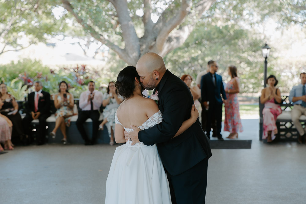 brides father gives her a kiss on the cheek after they finish their dance