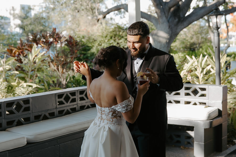 fun dancing photo of the bride and groom during their davis island garden club wedding 