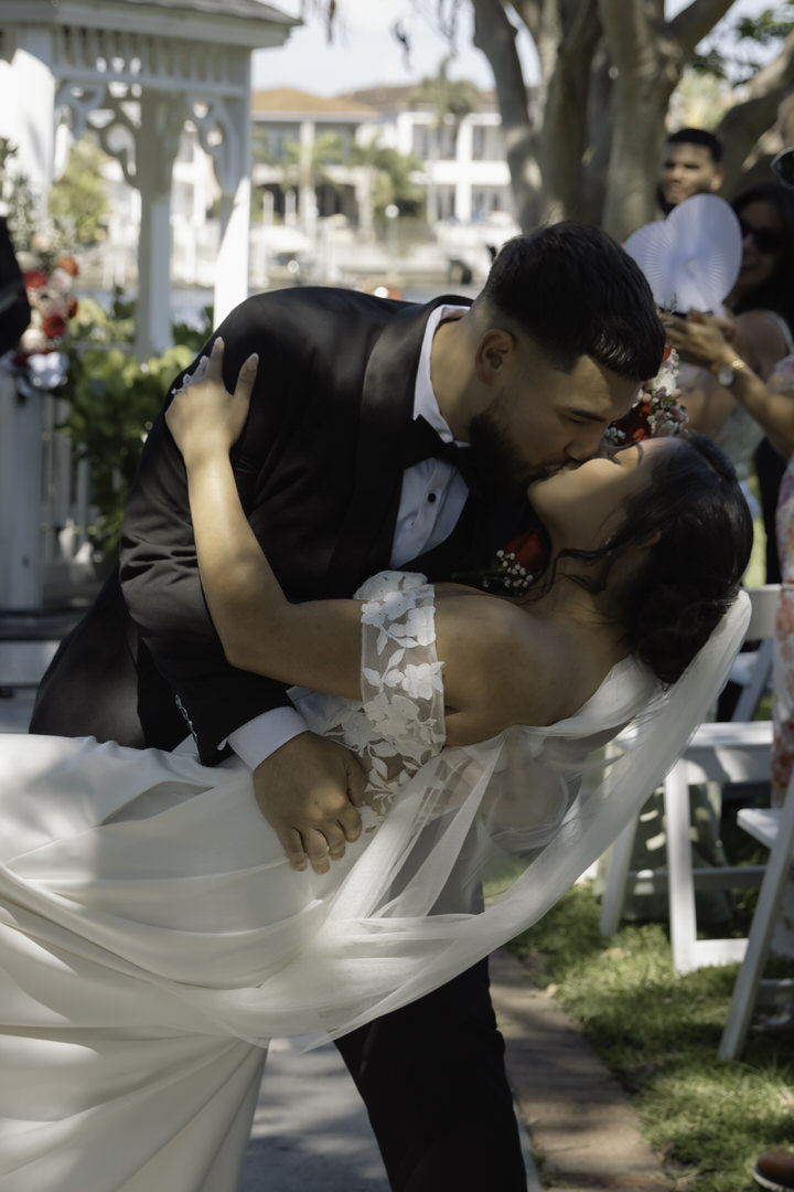 groom and bride kiss after saying I do during their davis island garden club wedding